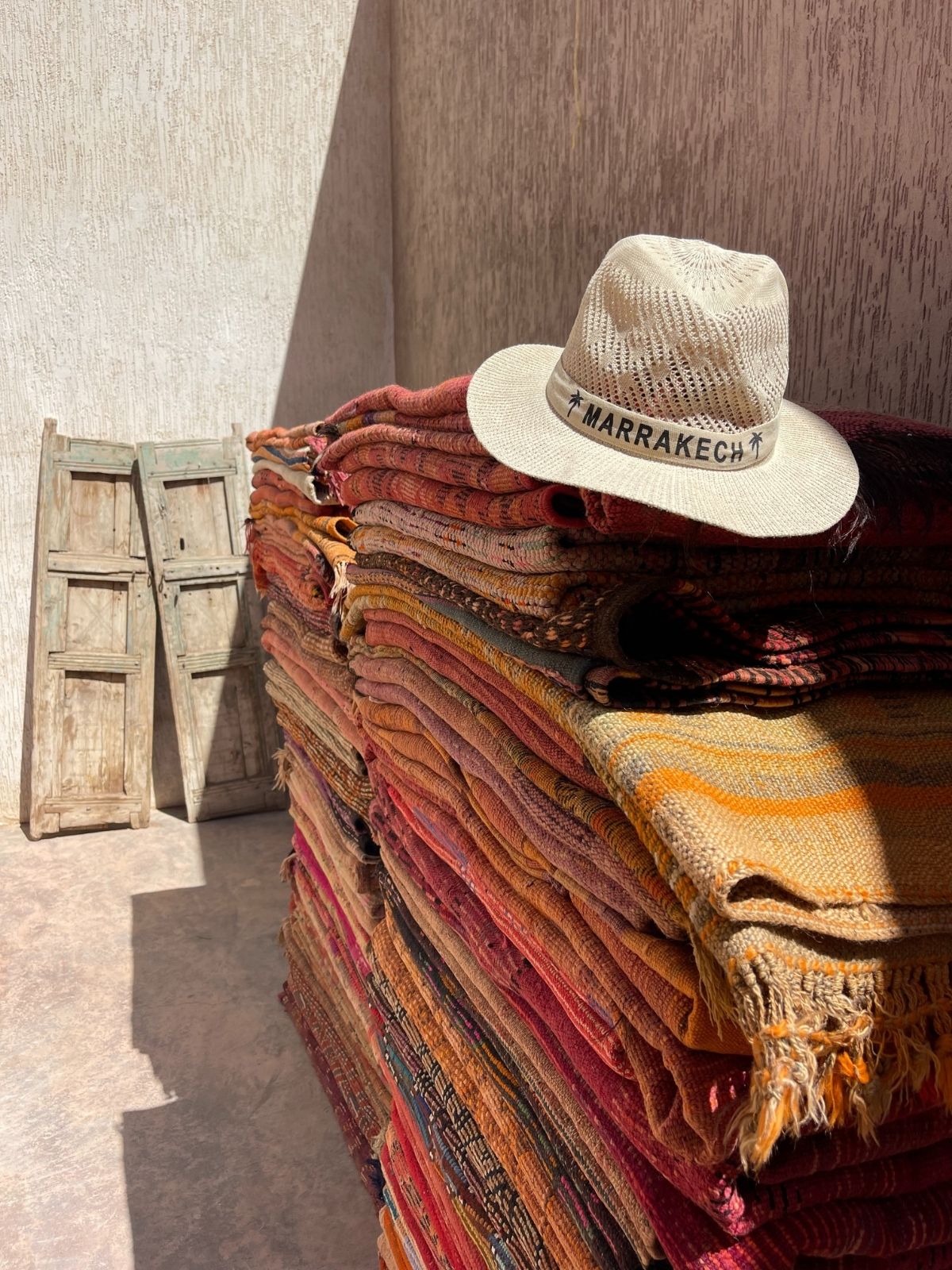 A stack of authentic vintage Moroccan rugs and Berber carpets