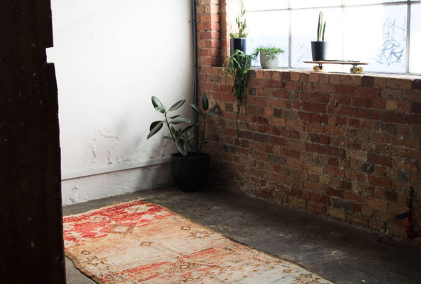 Vintage Moroccan rug on the floor in a warehouse in Melbourne