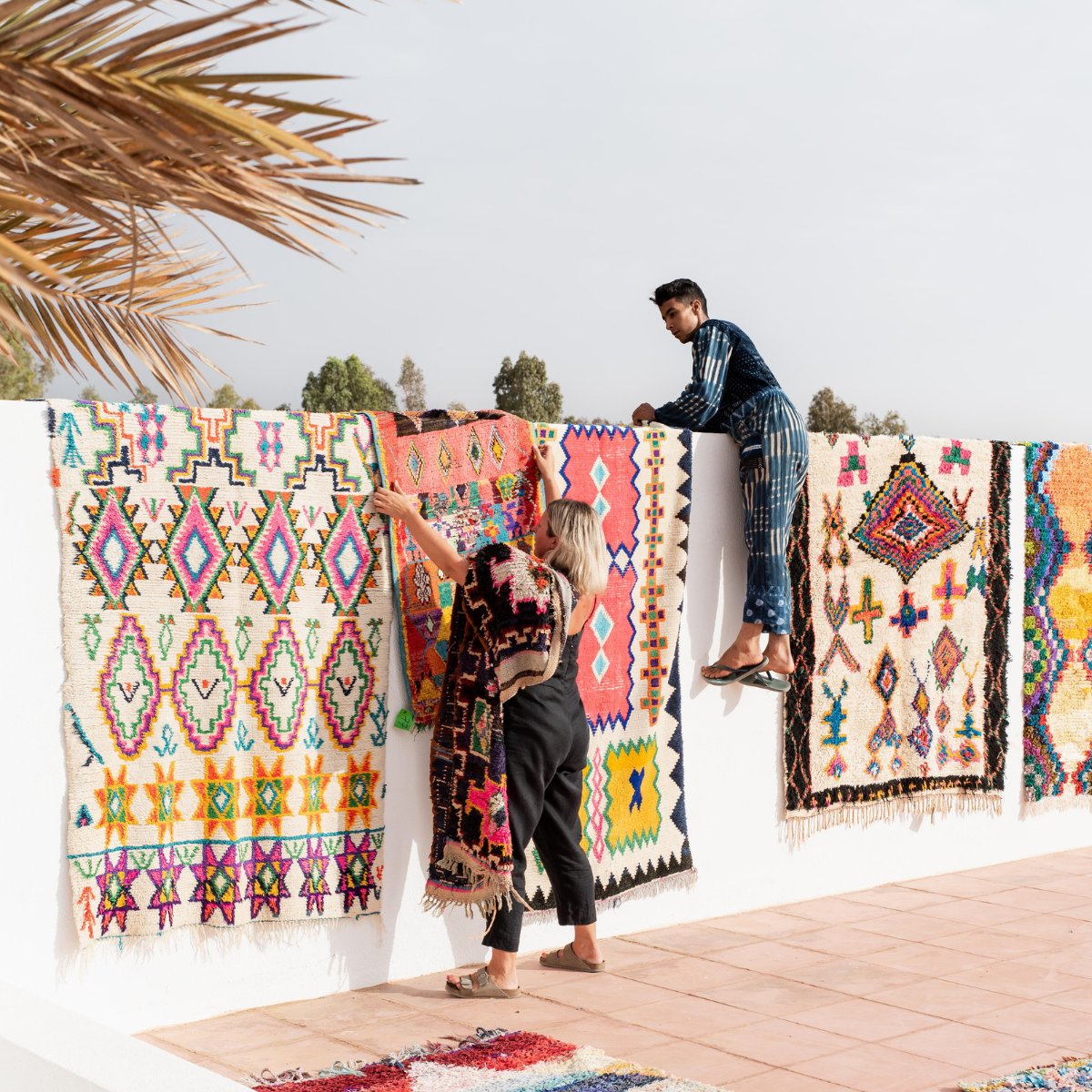 Bright & Colourful Vintage Moroccan Rugs Hanging On a wall in Marrakech - Nouvelle Nomad