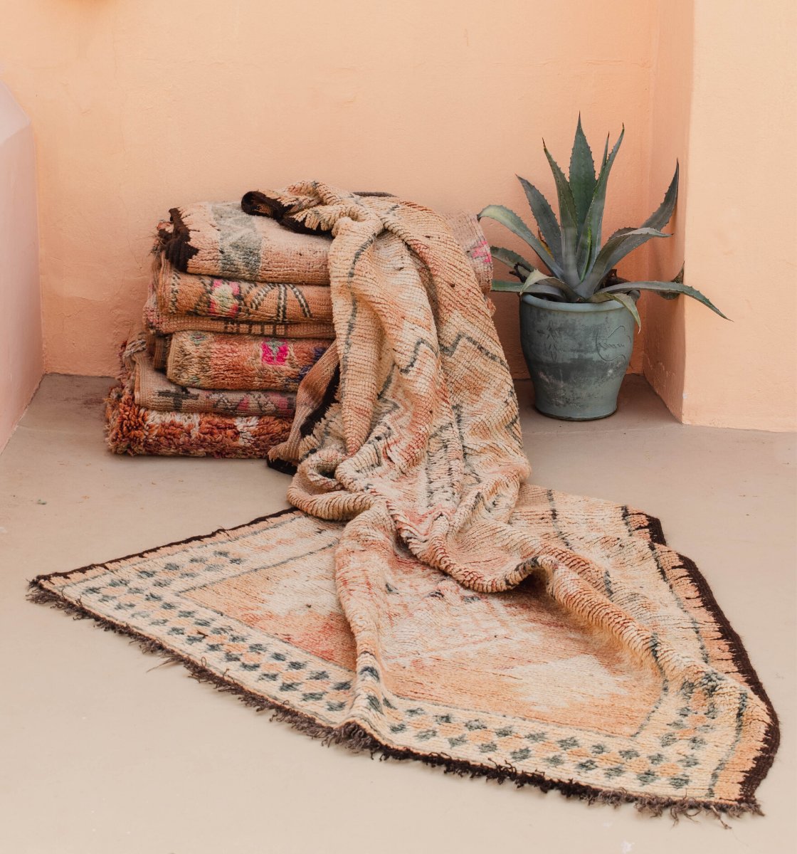 A stack of folded vintage Moroccan rugs Australia - Nouvelle Nomad