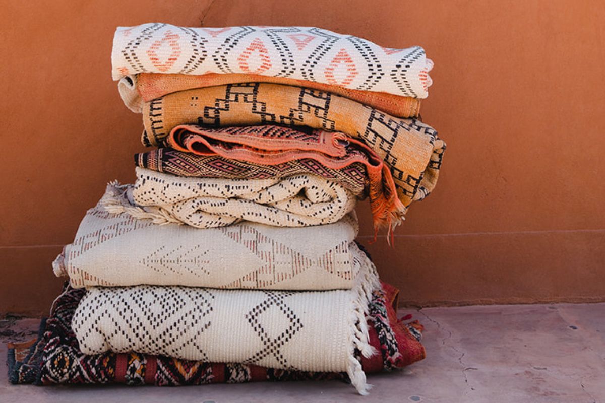 Stack of vintage Moroccan rugs - Nouvelle Nomad