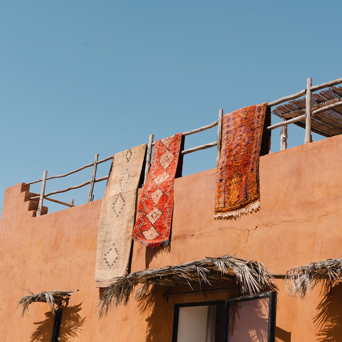 Vintage Moroccan Runners Hanging In The Sun In Marrakech - Nouvelle Nomad