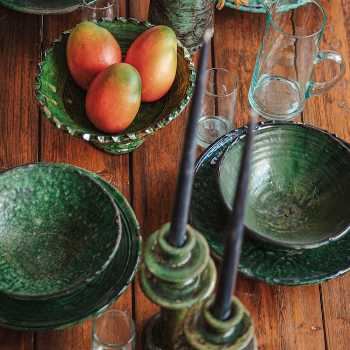 Green Moroccan Tamegroute Pottery bowls and candelabras on a timber table setting - Nouvelle Nomad