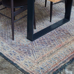Vintage Beni MGuild Rug in Iris and rust colour under a Mark Tuckey dining table - Nouvelle Nomad